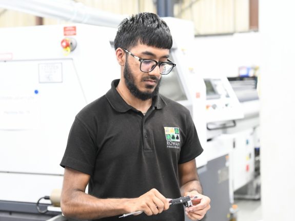 rowan precision mark world standards day with reflection on AS9100 and aerospace CNC machining